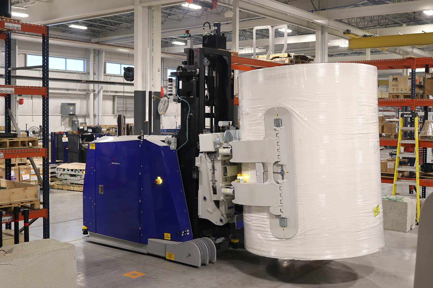 Infinity’s roster of AGVs features two vehicles: the CB39RC is a counterbalanced vehicle with a fully articulated clamp arm that boasts a 3,900kg lifting capacity (pictured), and the CT45CVR, an omnidirectional cradle vehicle with a built-in conveyor, capable of hauling 4,500kg
