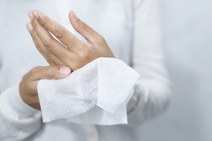 Woman,Using,Tissue,Paper,Clean,Your,Hands,To,Remove,Germs.